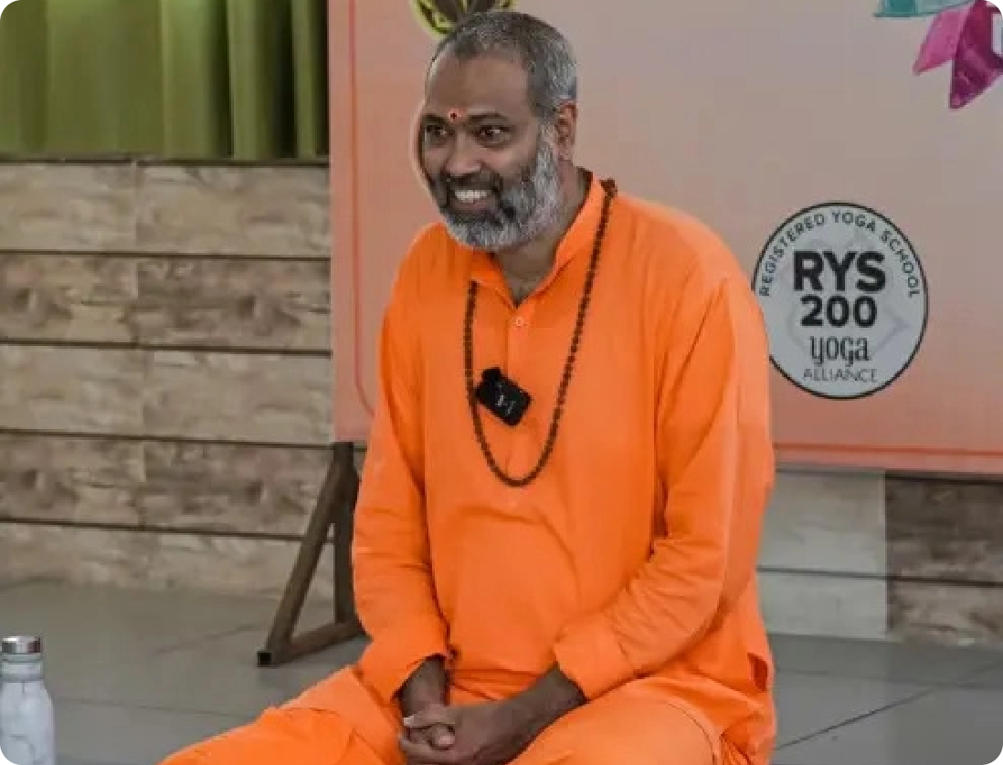 Swami Shivabrahmananda Saraswati teaching yoga philosophy and Vedanta during a session at Rishikesh Yog Nirvana