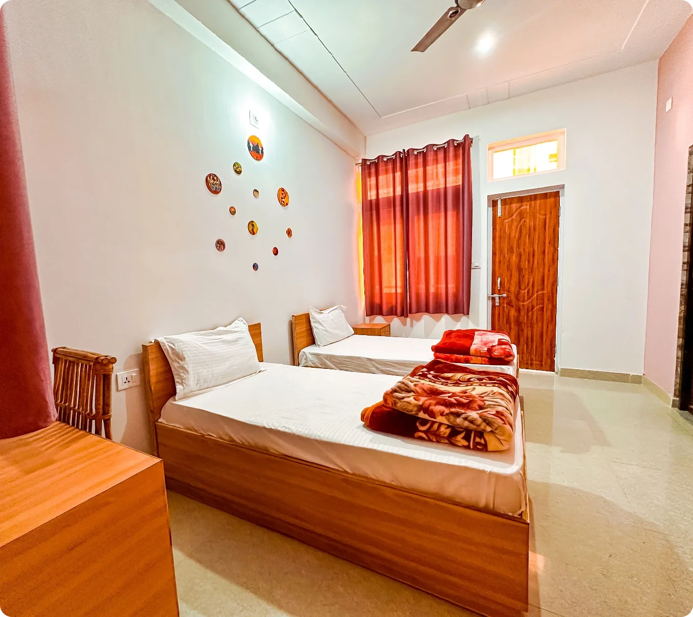 Clean and comfortable accommodation at Rishikesh Yog Nirvana in Tapovan — yoga student rooms with natural light and mountain views