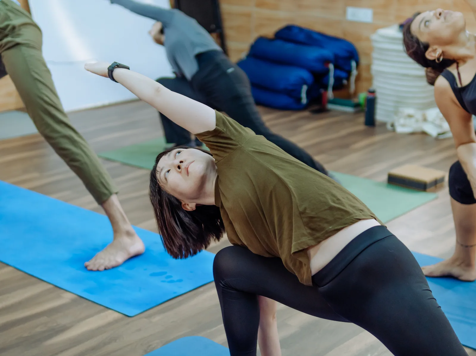 International students practising side stretches during 100-hour yoga training at Rishikesh Yog Nirvana