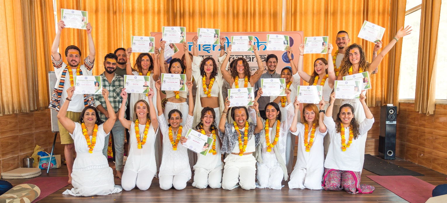 Students practising during 300-hour yoga teacher training at Rishikesh Yog Nirvana ashram in Tapovan