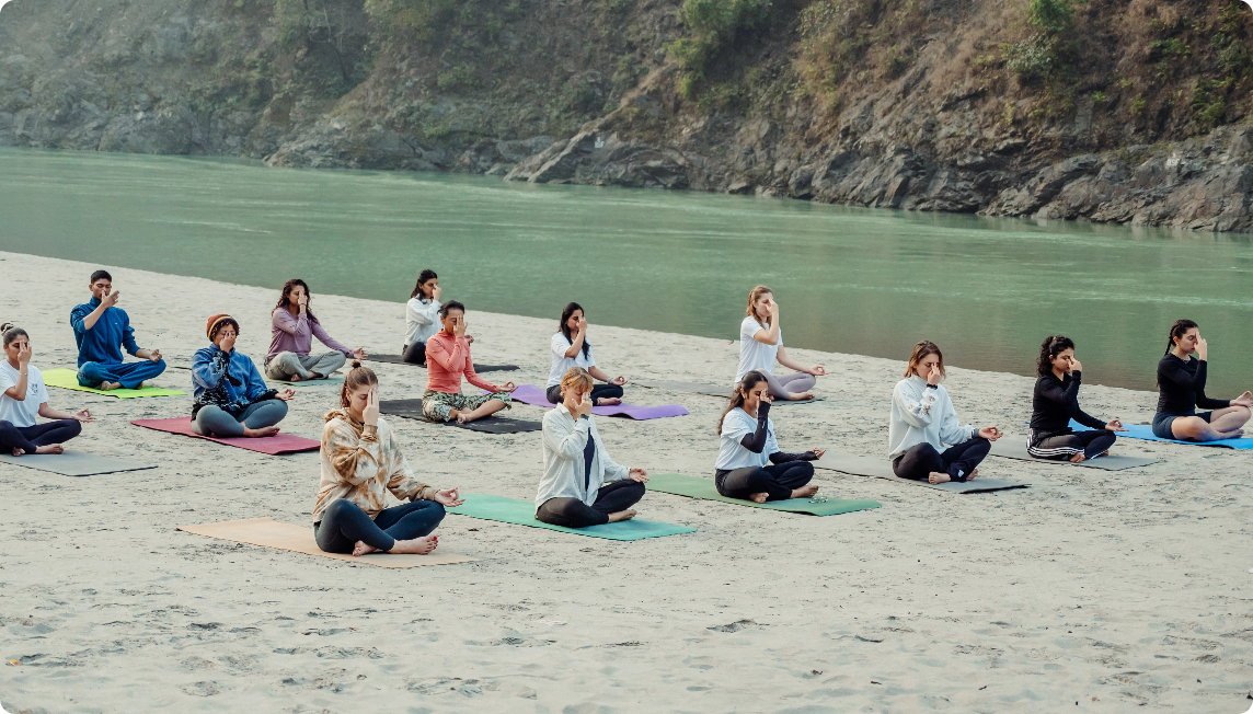 Advanced yoga practice by students during 300 hour yoga teacher training program in Rishikesh